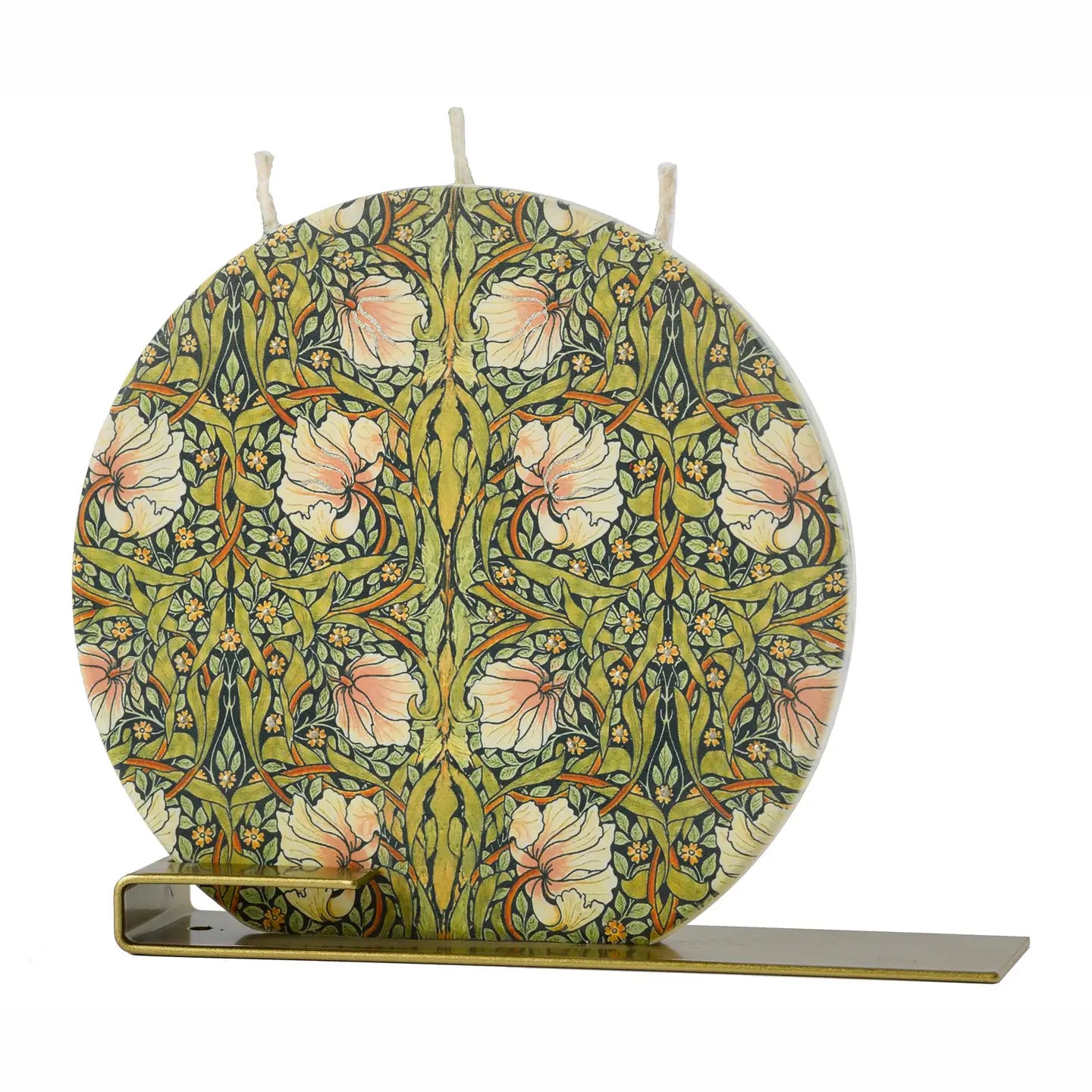 William Morris Pimpernel flat decorative candle featuring intricate botanical floral artwork in green, blush, and gold tones with brass display stand.