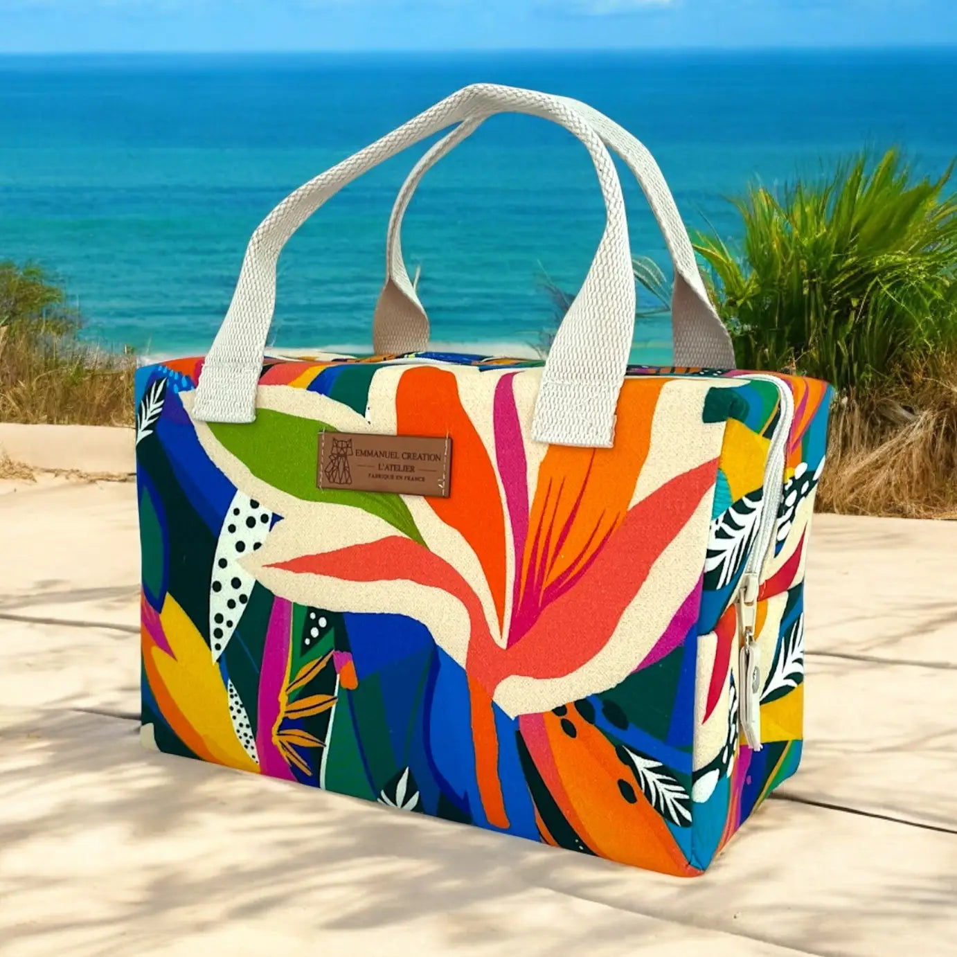 Colorful tropical insulated cooler tote bag handmade in France with vibrant abstract botanical print, cotton handles, and thermal-lined zippered interior.