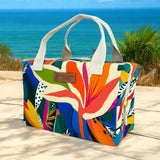 Colorful tropical insulated cooler tote bag handmade in France with vibrant abstract botanical print, cotton handles, and thermal-lined zippered interior.