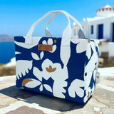 Blue and white insulated cooler tote bag with Mediterranean floral print, handmade in France with cotton handles and zip closure.