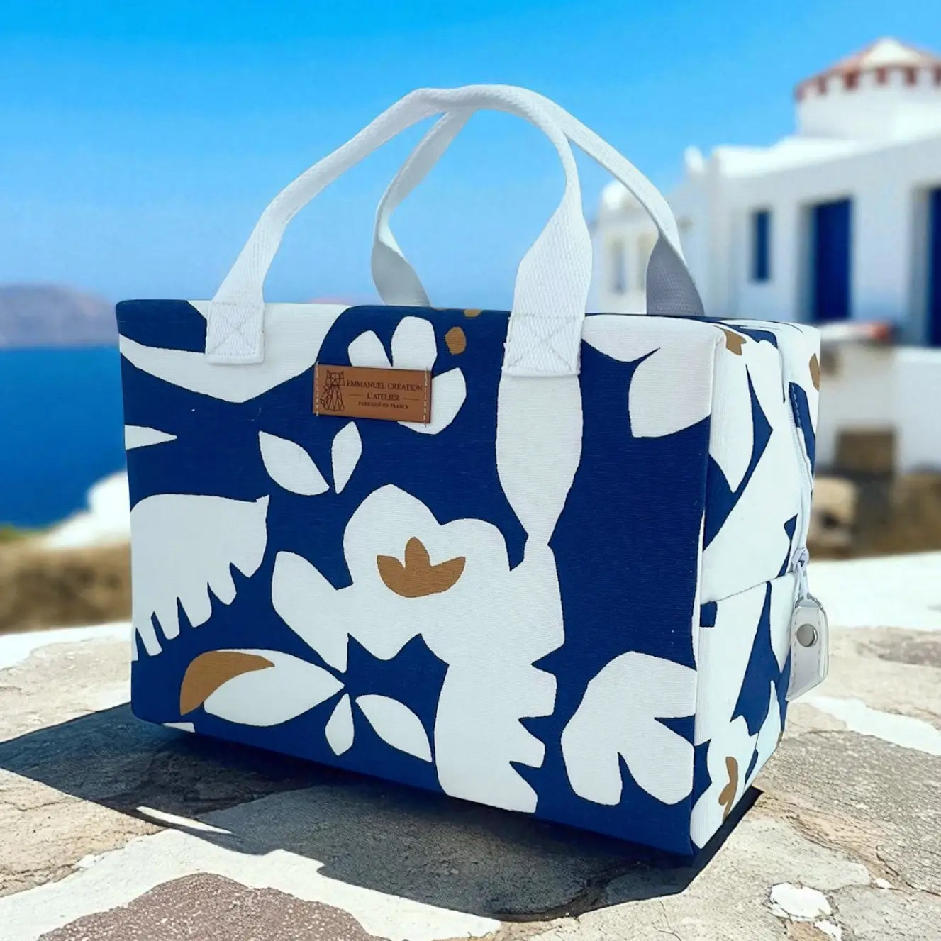 Blue and white insulated cooler tote bag with Mediterranean floral print, handmade in France with cotton handles and zip closure.