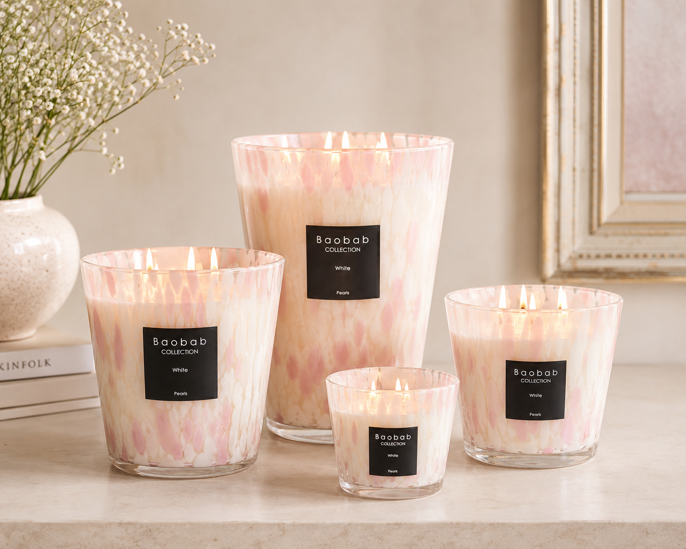 Baobab Collection White Pearls luxury scented candle in pearlized hand-blown glass vessel with floral orchid, freesia, and white musk fragrance.