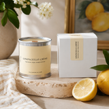 Limoncello crème soy candle with crackling wood wick in reusable tin and minimalist coastal packaging