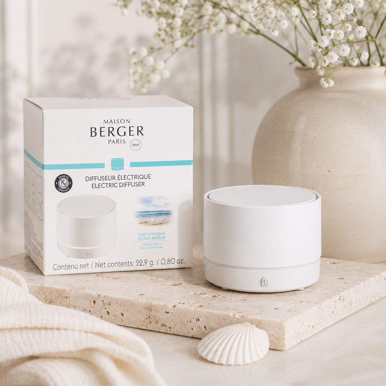 White Maison Berger Nomad portable electric diffuser with Ocean Breeze fragrance refill, USB rechargeable cordless home fragrance diffuser with minimalist modern design.