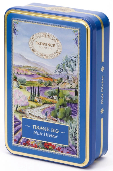 Provence d’Antan Divine Night Infusion tea tin opened to reveal individually wrapped blue herbal tea sachets neatly arranged inside a decorative blue metal box.