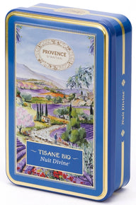 Provence d’Antan Divine Night Infusion tea tin opened to reveal individually wrapped blue herbal tea sachets neatly arranged inside a decorative blue metal box.