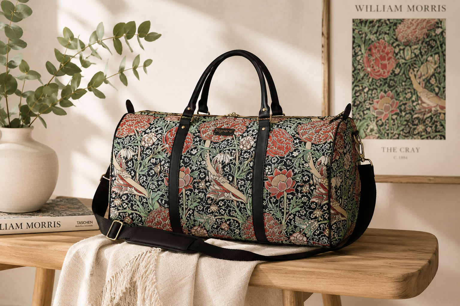 William Morris tapestry weekender duffel bag featuring The Cray floral pattern and faux leather handles