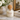 Luxury Champagne Dreams candle with cork lid in modern glass vessel, styled with soft florals and neutral decor for an elegant feminine home aesthetic.