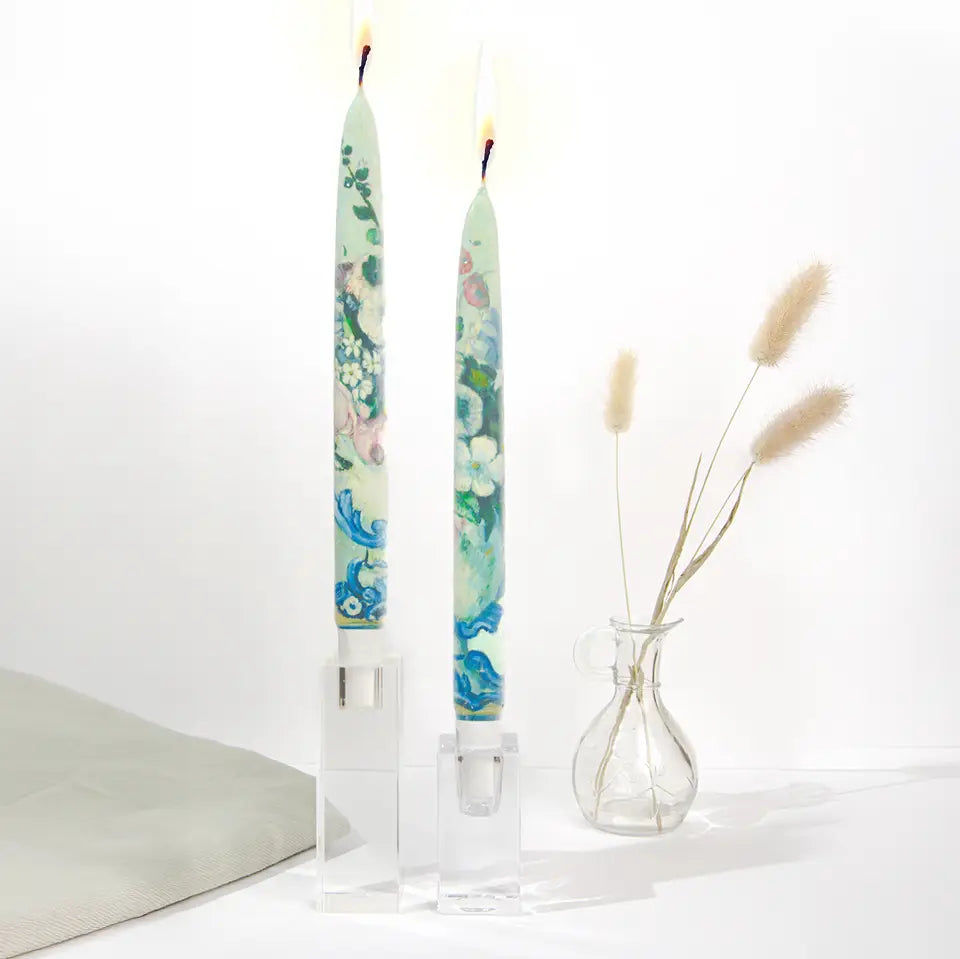 Set of two decorative taper candles inspired by Paul Cézanne Flowers in a Rococo Vase artwork featuring blue and green painterly floral designs.
